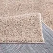 Dette produkt hedder Lazy, fremstillet af  materiale med en smuk Sand farve - SE Mattor