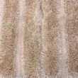Dette produkt hedder Moody Bow, fremstillet af Polyester materiale med en smuk Beige farve - SE Mattor