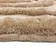 Dette produkt hedder Moody Bow, fremstillet af Polyester materiale med en smuk Beige farve - SE Mattor