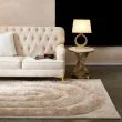 Dette produkt hedder Moody Bow, fremstillet af Polyester materiale med en smuk Beige farve - SE Mattor