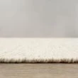 Dette produkt hedder Norrsken, fremstillet af 60 % Uld & 40% Bomuld  materiale med en smuk Fløde farve - SE Mattor