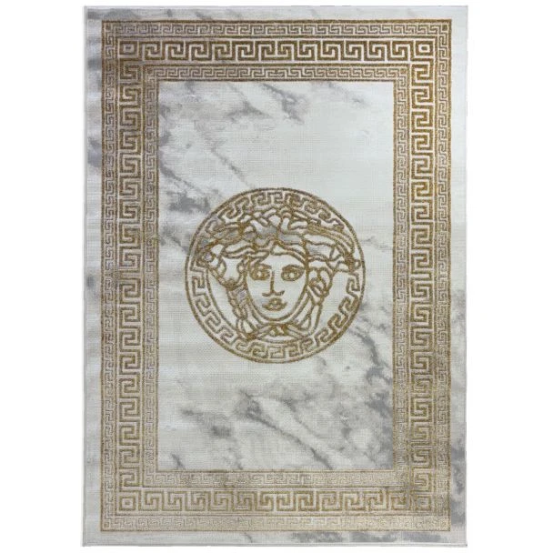 Dette produkt hedder Wico Versace Face, fremstillet af Polyester & Polypropylen materiale med en smuk Guld farve - SE Mattor